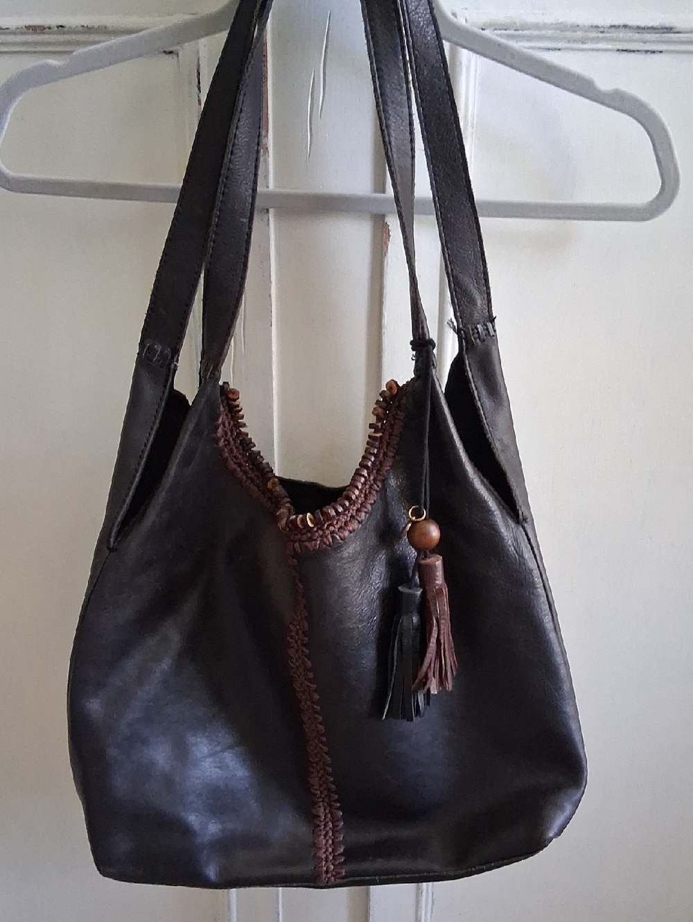 The Sak Dark Brown Leather Shoulder Bag with Tassel Accents